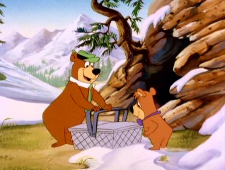 Eager to break their winter's fast at the start of "Yogi's Great Escape", Yogi Bear and Boo Boo find something sweet but not so edible inside this picnic basket.