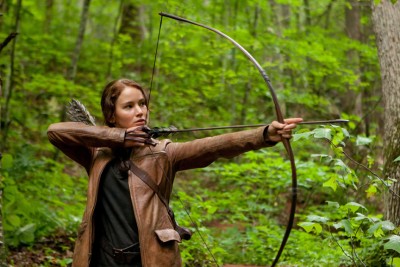 Katniss Everdeen (Jennifer Lawrence) aims her bow and arrow in "The Hunger Games."