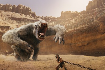 With the giant White Ape behind him, John Carter (Taylor Kitsch) pulls on a chain.