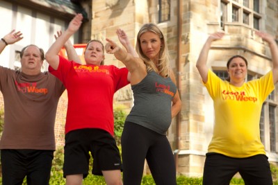 A pregnant Cameron Diaz leads a weight loss class that would appear to also be a reality television series.