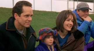 Mom's new boyfriend Patrick Sullivan (Gregory Harrison) enjoys watching Josh and Buddy play football with Jackie (Cynthia Stevenson) and her daughter Andrea (Alyson MacLaren).