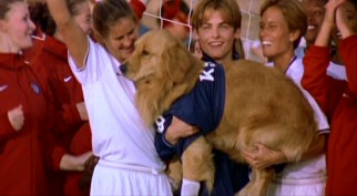 Brandi Chastain leaves her shirt on, as does teammate Tisha Venturini, to celebrate Buddy's World Cup-winning stop. Yes, the dog is apparently allowed to goaltend for the U.S. Women's Soccer Team.