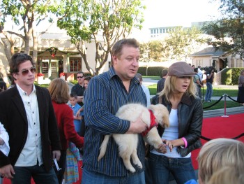 Paul Rae walks the red carpet with one of the puppies. He'll never get away with it!