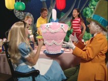 The Virtual Wonderland Party isn't so much virtual as it is watching Alice, the Mad Hatter, and three unnamed children marvel at an unbirthday cake.