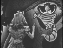Kathryn Beaumont and Sterling Holloway reprise their roles as Alice and the Cheshire Cat in this excerpt from "The Fred Waring Show."