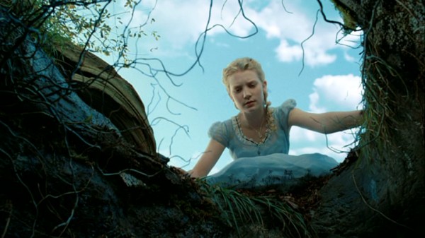 Nineteen-year-old Alice Kingsleigh (Mia Wasikowska), the 2010 take on Lewis Carroll's protagonist, peers down the famed rabbit hole near the beginning of Tim Burton's "Alice in Wonderland."
