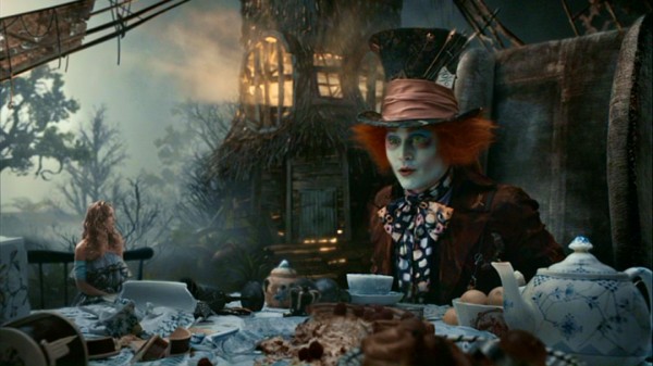 Alice's size issues continue as, shrunken, she stands only slightly taller than the teapot at the Mad Hatter's (Johnny Depp) tea party.