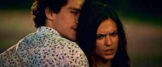 Ellie (Odette Yustman) demonstrates she's the wild one with a jukebox Divinyls sing-along inside and this very public display of affection with Chucho (Michel Noher) outside the local bar.