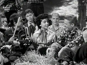 Come on, it's lovely weather for a hayride together with you! At the encouragement of the gang, Annette reprises her party song "How Will I Know My Love" with a little more oomph. And just like that, a musical career was born.