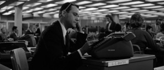 C.C. Baxter (Jack Lemmon) spends another day at his desk in a seemingly endless office.