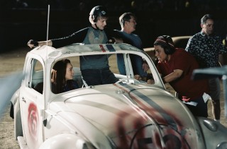 Angela Robinson provides direction to Lindsay Lohan and Jimmi Simpson during filming of "Herbie: Fully Loaded"'s demolition derby scene.