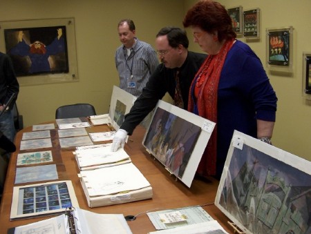 Another table full of "Lady and the Tramp" art. Vice President of DVD Production David Jessen appears on the far left.
