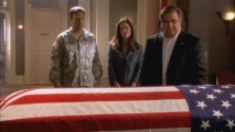 Staff Sergeant James Favreau (guest star Dan Lauria) approaches the flag-draped casket of the best friend he hasn't seen in decades while Michael (Brian McNamara) and Claudia Joy (Kim Delaney) look on in "The Hero Returns."