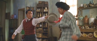 Passepartout (Jackie Chan)uses the power of his tophat to defeat an Asian bad guy.