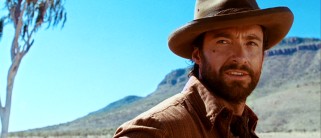 Move over Wolverine and The Boy from Oz. Hugh Jackman has a new personality as Drover, an independent cattle herder who likes a nice tight shirt.