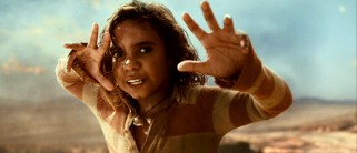 Aborigine preteen Brandon Walters earned Oscar buzz with his very first piece of acting as half-caste boy Nullah. Here, Nullah tries to ward them cheeky bulls away from a cliff with his magical hands.