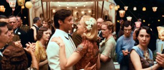 If you thought that Baz Luhrmann got romance out of his system with "Strictly Ballroom", "Romeo + Juliet", and "Moulin Rouge!", then you thought wrong. Sarah (Nicole Kidman) dances with a cleaned-up Drover (Hugh Jackman) at a fancy social function.
