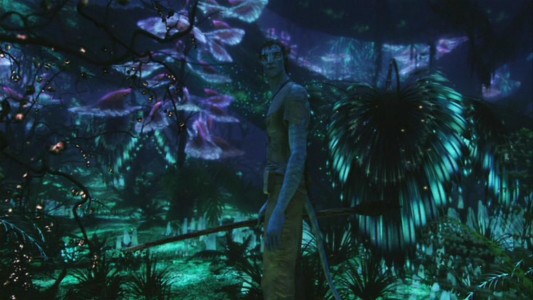 The nighttime landscape of Pandora comes alive all around Jake Sully, providing illumination of two different sorts.