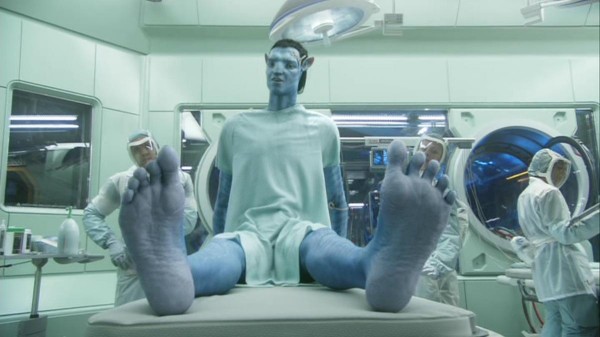 Jake (Sam Worthington) admires his new avatar body and the ability to once again wiggle his toes.