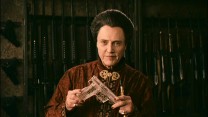 Feng (Christopher Walken) shows off an innovative polymer gun in this short deleted scene.