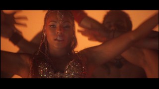 Bronze-colored Ashanti performs one of the film's weakest musical numbers.