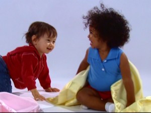 Kids enjoy the simple pleasures of life, like the joy of playing with a blanket.