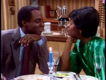Benson shares a romantic candlelight dinner with a state senator (Beverly Todd) in "Benson in Love."
