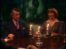 The Governor, Miss Kraus, and the rest of the staff join hands for a seance in "Ghost Story."