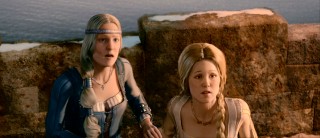 Beowulf's aged wife and young mistress (Alison Lohman) unite in shocked reaction to the sight of a fiery dragon.