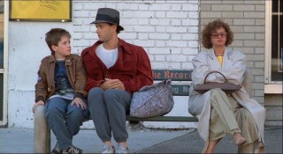 Billy and Josh are joined by a woman on the bus stop bench in this alternate version of an existing scene.