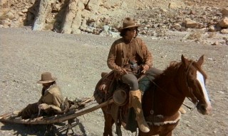 Billy Two Hats (Desi Arnaz Jr.) thoughtfully drags his injured old partner along with him.