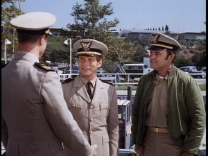 Ensign Garland (Robert Morse) reports for duty, earning no points for punctuality.