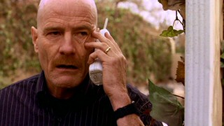 Chemistry teacher Walter H. White (Bryan Cranston) takes the cordless home phone outside to deal with one of several concerns growing out of his secret second life as a big-time manufacturer of methamphetamine.