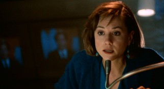 Executive-producing Tom's first on-air report, Jane Craig (Holly Hunter) is on the ball and in his ear.