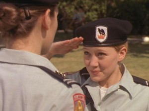 Cadet Kelly sarcastically salutes her unfriendly superior.