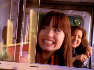 Upon seeing Camp Rock for the first time, Mitchie (Demi Lovato) flashes her trademark toothy grin alongside her caterer mother (Maria Canals Barrera).