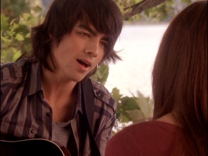 Shane Grey (Joe Jonas) treats Mitchie to some impromptu acoustic singing -- cue the back-up vocals.
