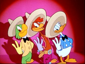 Jose, Panchito, and Donald illustrate with their fingers the number of Caballeros they make. (Three.)