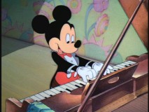 Mickey tickles the keys to accompany Clara's clucking in "Orphans' Benefit" for which Disney recycled the soundtrack from a short animated seven years earlier.