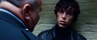 Tough guy Bruce (Tom Hughes) gets a jail cell wake-up call from the ordinarily friendly Sgt. Davies.