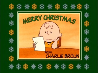 The short segments of "Charlie Brown's Christmas Tales" are introduced by character cards like this bordered blockhead one.