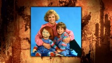 Catherine Hicks, Alex Vincent, and Chucky pose looking like a warm, fuzzy '80s sitcom family in this photo gallery still.