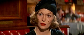 Evelyn Mulwray (Faye Dunaway) dresses the part of grieving widow, but whether she feels it too is less certain.