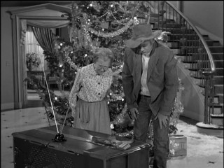 Granny (Irene Ryan) and Jed (Buddy Ebsen) try to make sense of the new washing machine the Drysdales have given them in "Christmas at the Clampetts." (It's a television.)