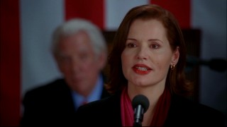 Geena Davis plays Mackenzie "Mac" Allen, the first female President of the United States. In the background, Speaker of the House Nathan Templeton (Donald Sutherland) looks on.