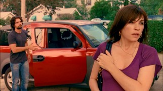 A frustrated Joyce (Julianna Margulies) and Tony (Steven Strait) leave the red car in which they went "shopping."