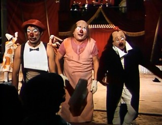 These old Italian clowns get up to some mischief with an oversized mallet.