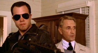Misters Tate (Adam Baldwin) and Cohen (Roy Scheider) are on the job, crashing the Knight family's rural new home and taking out almost everyone there.