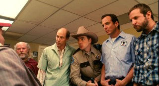 Among the Heartland townsfolk who take their college football seriously are, left to right, barber (Jon Gries), sheriff (Dax Shepard), mailman (Will Arnett), and cowboy (Bradley Cooper).