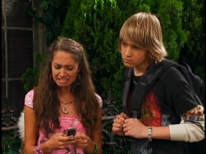 Newt (Jason Dolley) joins Meena (Maiara Walsh) for some cell phone "Cory in the House" viewing.